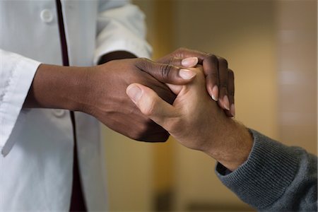 people in the hospital holding the hand of a patient - Doctor holding patient's hand Stock Photo - Premium Royalty-Free, Code: 632-03754371