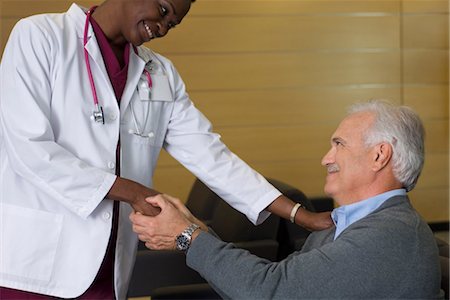 doctor patient shake hands - Doctor reassuring patient in waiting room Stock Photo - Premium Royalty-Free, Code: 632-03754424