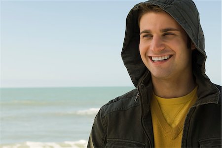 pic of young men at the beach - Young man at beach, portrait Stock Photo - Premium Royalty-Free, Code: 632-03754493