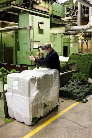 fibra - Textile worker unpacking materials in carpet tile factory Stock Photo - Premium Royalty-Free, Code: 632-03754529