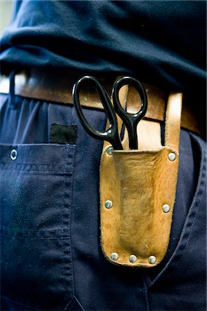 fondina - Scissors in pouch on tool belt Fotografie stock - Premium Royalty-Free, Codice: 632-03754578