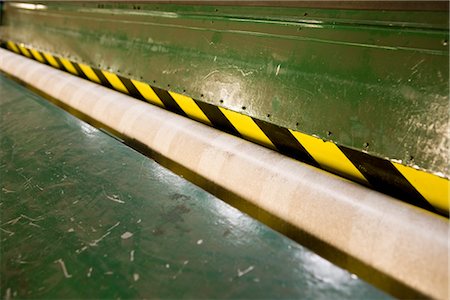 roll fabrics - Scuffer machine and empty cardboard roll in carpet tile factory Stock Photo - Premium Royalty-Free, Code: 632-03754586