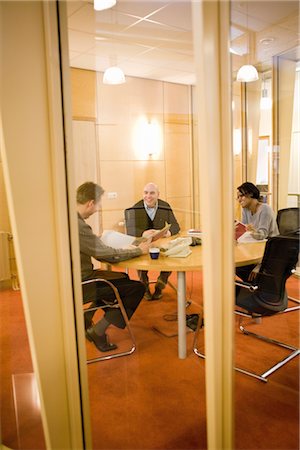 plant meeting - Colleagues discussing carpet samples in meeting room Stock Photo - Premium Royalty-Free, Code: 632-03754581