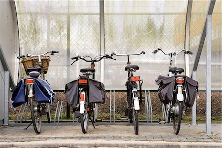 reportage style - Bicycles parked in sheltered bicycle rack Stock Photo - Premium Royalty-Free, Code: 632-03754601