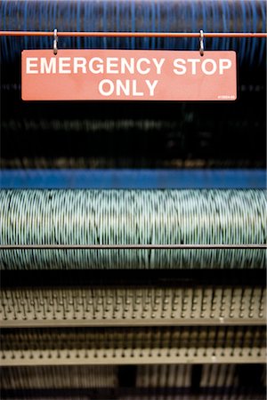 Emergency stop on weaving machine in carpet tile factory Foto de stock - Sin royalties Premium, Código: 632-03754603