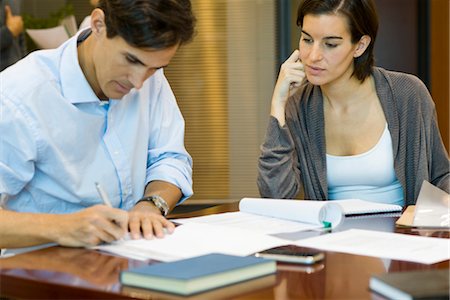 sign documents - Executives doing paperwork together Stock Photo - Premium Royalty-Free, Code: 632-03754727