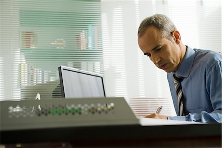 Businessman working in office Stock Photo - Premium Royalty-Free, Code: 632-03779531