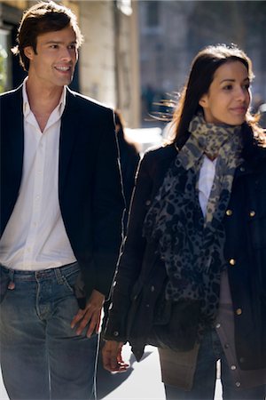 Couple walking together, backlit Stock Photo - Premium Royalty-Free, Code: 632-03779638