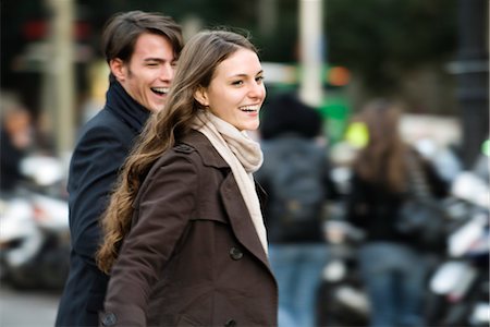 pedestrian (female) - Young couple laughing and walking together outdoors Foto de stock - Sin royalties Premium, Código: 632-03779699