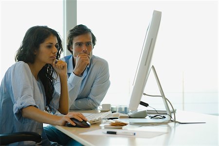 desk with monitor - Couple working on computer at home Stock Photo - Premium Royalty-Free, Code: 632-03779743