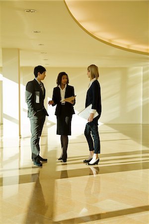 simsearch:632-03779792,k - Business executives standing together talking Stock Photo - Premium Royalty-Free, Code: 632-03779829