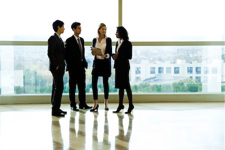 simsearch:632-03779792,k - Business executives standing together talking Stock Photo - Premium Royalty-Free, Code: 632-03847996