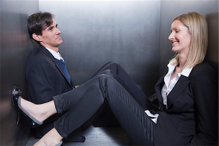 slacking off - Colleagues trapped in elevator, sitting on floor chatting Stock Photo - Premium Royalty-Free, Code: 632-03848142