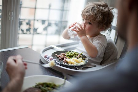 Toddler boy drinking glass of water Stock Photo - Premium Royalty-Free, Code: 632-03848287