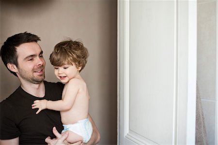 dad diaper - Father holding toddler son Stock Photo - Premium Royalty-Free, Code: 632-03848306