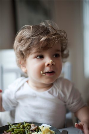 smashed potatoes - Toddler boy with food on his face, portrait Stock Photo - Premium Royalty-Free, Code: 632-03848310