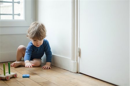 simsearch:632-03848358,k - Toddler boy playing with toy Stock Photo - Premium Royalty-Free, Code: 632-03848355