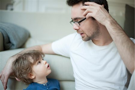 father son looking at each other - Father talking to young son, portrait Stock Photo - Premium Royalty-Free, Code: 632-03848395