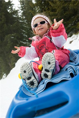 Toddler girl on sled Stock Photo - Premium Royalty-Free, Code: 632-03897866