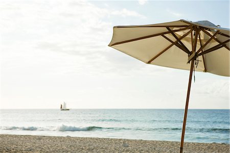 sailboat beach - Beach umbrella Stock Photo - Premium Royalty-Free, Code: 632-03897910