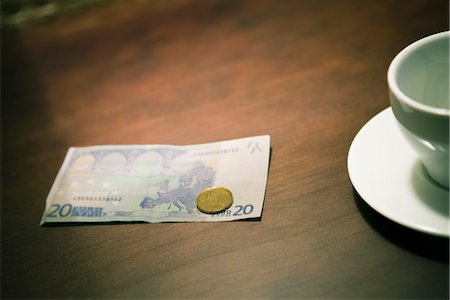 euro coffee house - Empty coffee cup and money on table Stock Photo - Premium Royalty-Free, Code: 632-03898090