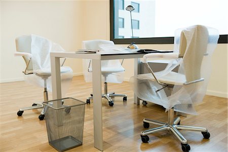 New office chairs covered in bubble wrap Stock Photo - Premium Royalty-Free, Code: 632-03898370