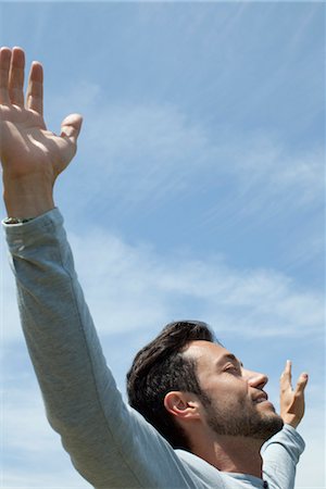 respiring - Man in outdoors with arms outstretched and eyes closed Stock Photo - Premium Royalty-Free, Code: 633-05401420
