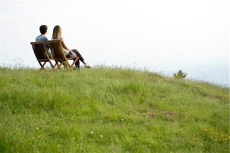 romantic rural couple - Couple sitting on chairs on top of hill looking at view Stock Photo - Premium Royalty-Free, Code: 633-05401468