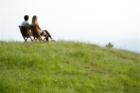 people side by side - Couple sitting on chairs on top of hill looking at view Stock Photo - Premium Royalty-Free, Code: 633-05401468