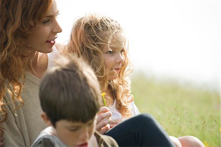 simsearch:633-05401631,k - Mother and two children relaxing together outdoors Stock Photo - Premium Royalty-Free, Code: 633-05401472