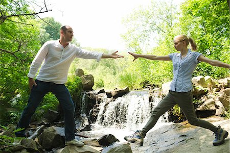 person looking at nature - Couple hiking, woman reaching for man's hand Stock Photo - Premium Royalty-Free, Code: 633-05401636