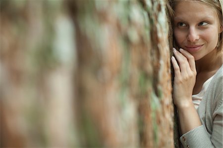 female tree huggers - Woman hugging tree, portrait Stock Photo - Premium Royalty-Free, Code: 633-05401902