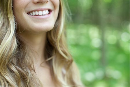 simsearch:633-05401584,k - Young woman with toothy smile, cropped Stock Photo - Premium Royalty-Free, Code: 633-05401916