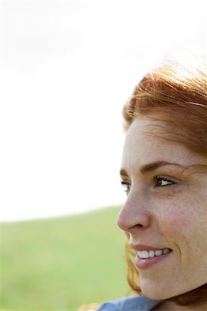 side profile face smile - Woman outdoors, looking away, portrait Stock Photo - Premium Royalty-Free, Code: 633-05401921