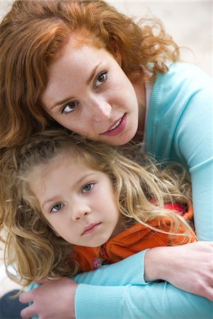 simsearch:633-05401631,k - Mother embracing young daughter protectively Stock Photo - Premium Royalty-Free, Code: 633-05402006