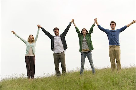 Young adults holding hands Foto de stock - Sin royalties Premium, Código: 633-05402003