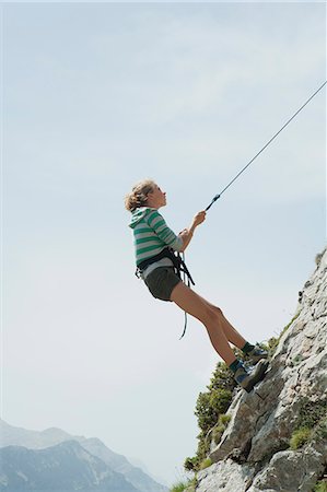 Preteen girl rock climbing Stock Photo - Premium Royalty-Free, Code: 633-06354948