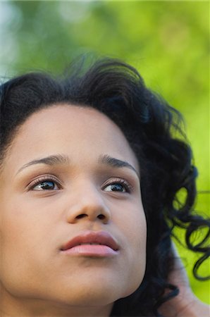 simsearch:633-08150986,k - Young woman looking up in thought, portrait Stock Photo - Premium Royalty-Free, Code: 633-06354983