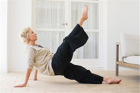 side view mature woman - Mature woman practicing pilates Stock Photo - Premium Royalty-Free, Code: 633-06355075