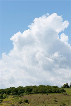 simsearch:633-06406753,k - Cumulus clouds over countryside Stock Photo - Premium Royalty-Free, Code: 633-06406342