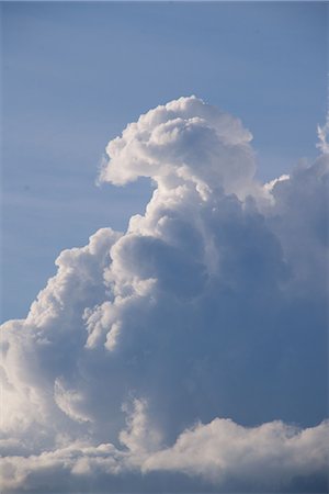 simsearch:633-06406753,k - Fluffy cumulus clouds against blue sky Stock Photo - Premium Royalty-Free, Code: 633-08151003