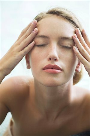 spa facial - Woman relaxing in pool with eyes closed Stock Photo - Premium Royalty-Free, Code: 633-08151037