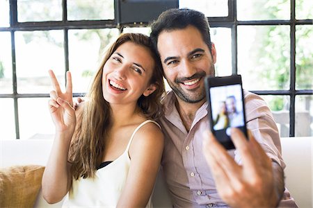 peace symbol - Couple taking selfie Stock Photo - Premium Royalty-Free, Code: 633-08482272