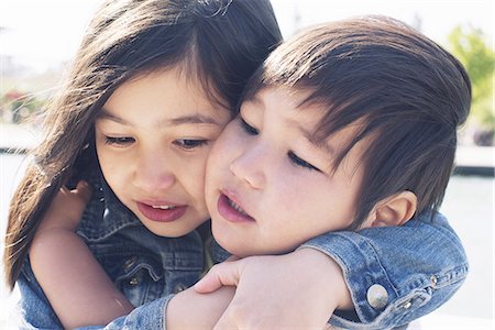 sister hugs baby - Young siblings embracing Stock Photo - Premium Royalty-Free, Code: 633-08726210