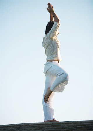 simsearch:632-03651843,k - Man standing in tree pose Stock Photo - Premium Royalty-Free, Code: 633-01274350