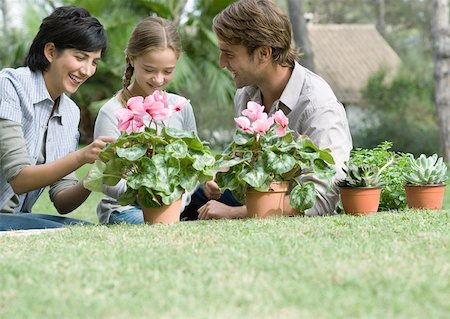 family yard work - Family planting flowers Stock Photo - Premium Royalty-Free, Code: 633-01274739