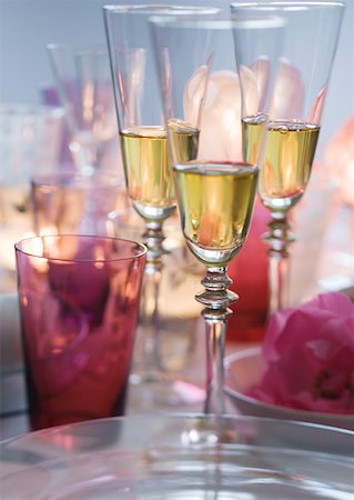 Glasses of champagne on set table Stock Photo - Premium Royalty-Free, Code: 633-01274881