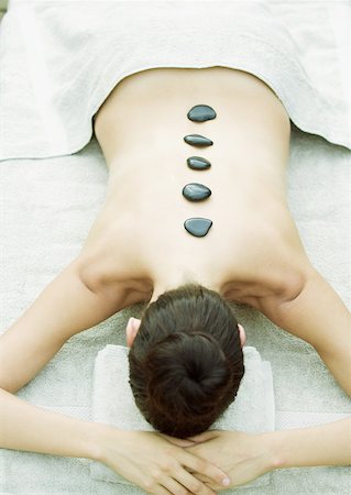 simsearch:633-02128630,k - Woman having lastone therapy massage Foto de stock - Sin royalties Premium, Código: 633-01274920