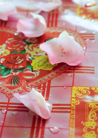 simsearch:633-01274235,k - Rose petals on decorative tablecloth Stock Photo - Premium Royalty-Free, Code: 633-01274945
