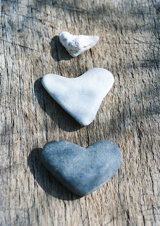 stone heart - Heart-shaped stones on wood Stock Photo - Premium Royalty-Free, Code: 633-01274940